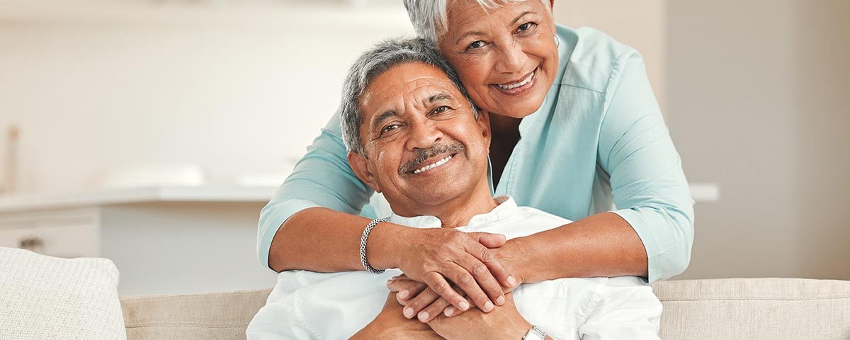 happy Hispanic couple on hospital indemnity