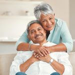 happy Hispanic couple on hospital indemnity