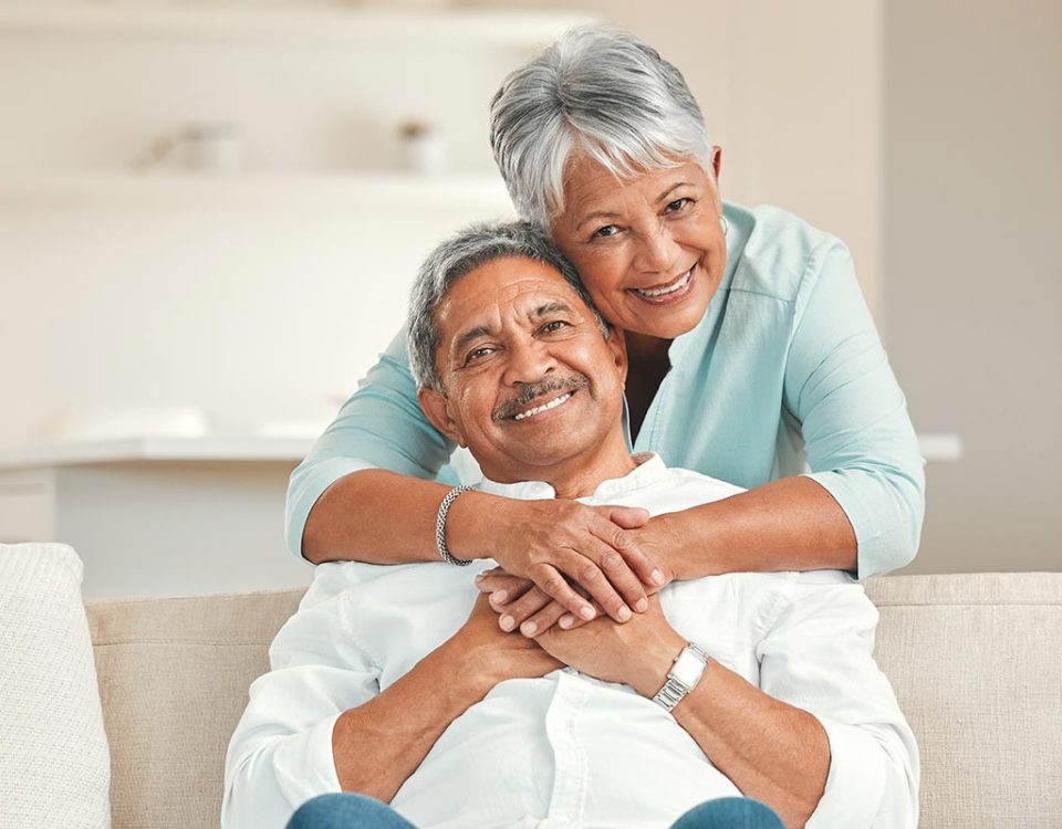 happy Hispanic couple on hospital indemnity